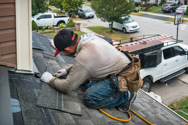 Professional Roofing technician working in Chelsea, MI